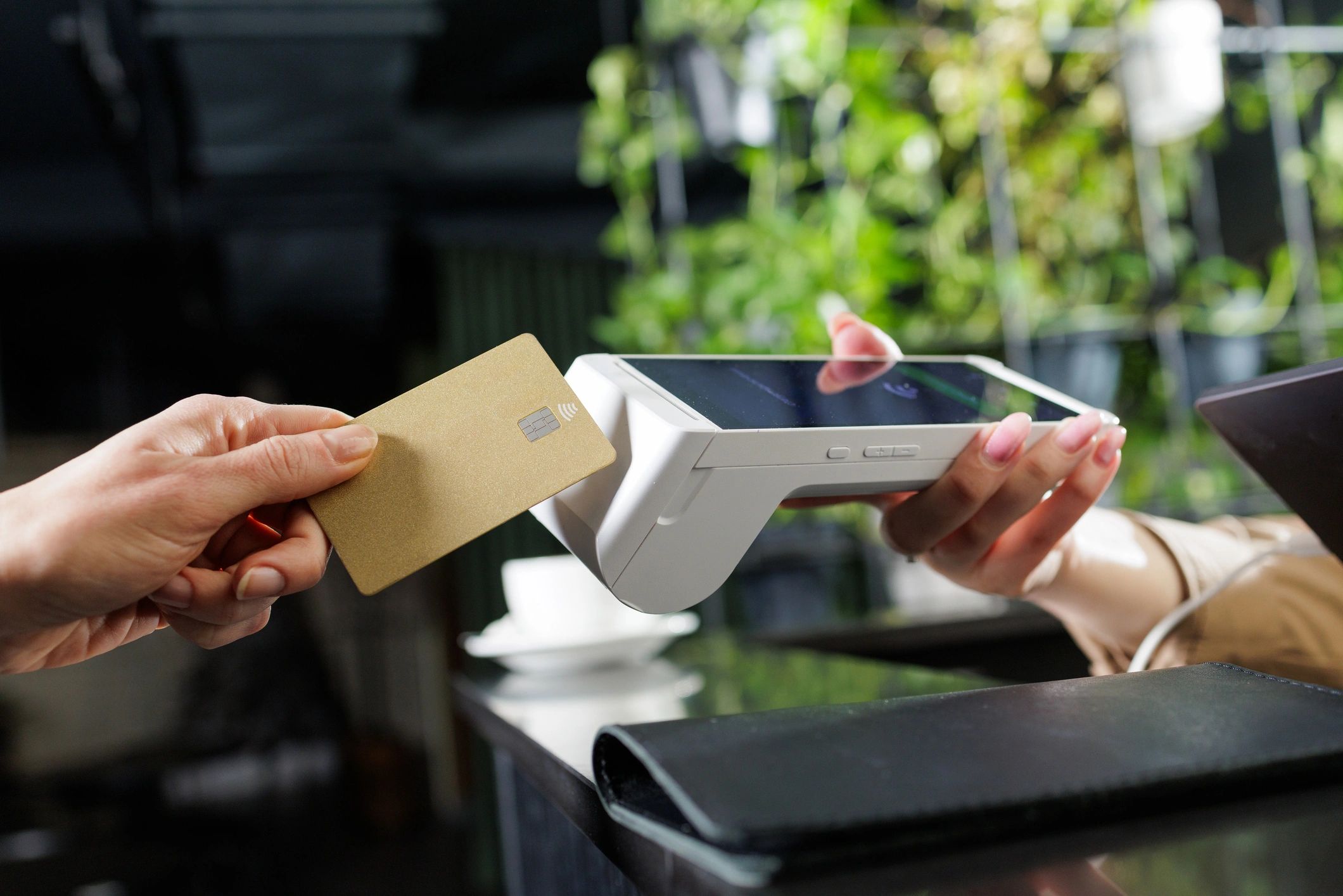 Tablet and handheld POS terminal at a counter